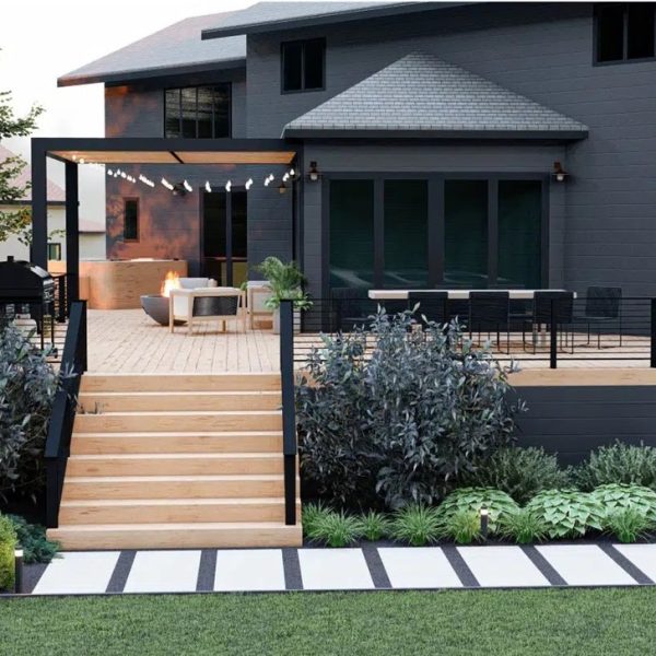A set of wooden deck stringers with a natural finish, neatly installed on a lush, landscaped lawn.